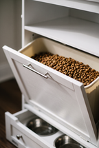 Pantry feeding station tilt-out food bin close-up